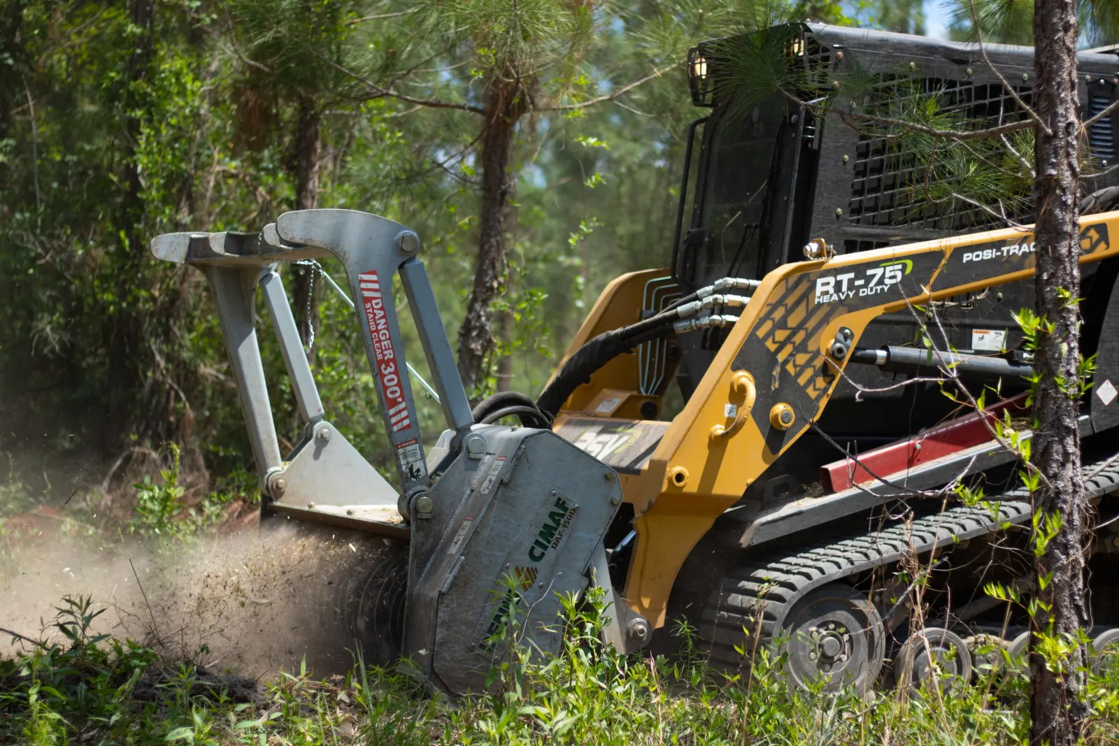 Forestry mulcher clearing underbrush in North Florida pine woods